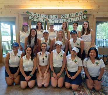 A group of women golfers posing indoors under a Northern Greens Golf Collective banner.