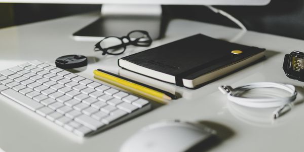 Tidy desk symbolizing streamlined workflows, enhanced productivity, and business efficiency.