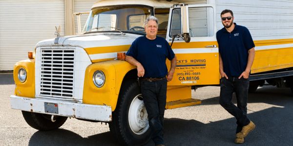 Photo of Rocky & Michael in front of the original truck.