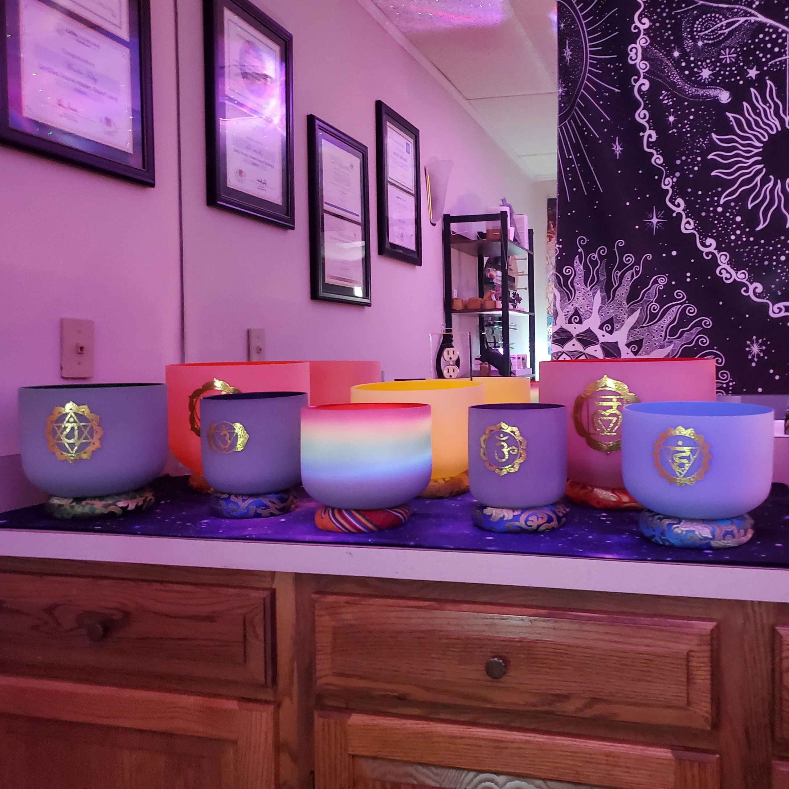 8 Colored Crystal Quartz Singing Bowls.