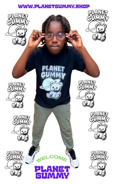 Young person modeling a Planet Gummy t-shirt with multiple logos and a website link.
