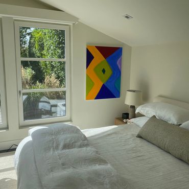 Marina Adams painting in beach home.