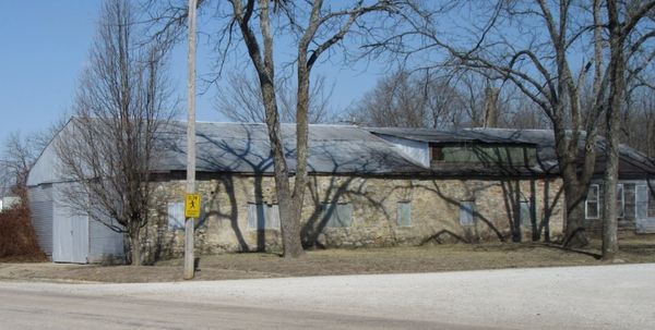 Farm implement and car garage owned and operated by Art