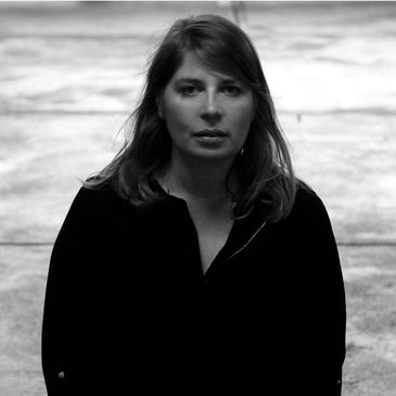 Professional headshot of Anne Muller: Musical Score