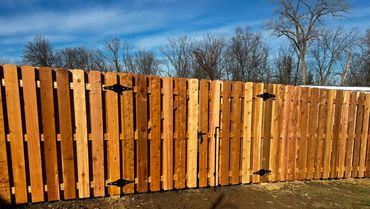 cedar wood fence with a double drive gate