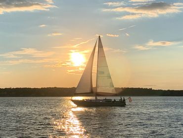 Sailing Vessel Phoenix under sail at sunset