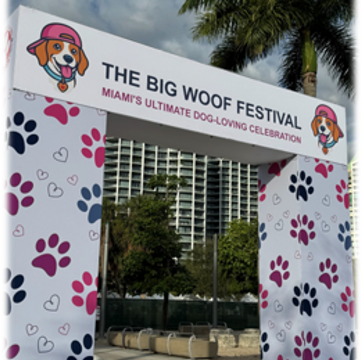Entrance arch to The Big Woof Festival with dog-themed decorations.