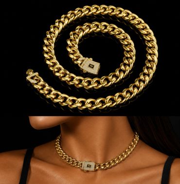 Elegant gold chain necklace with a diamond-studded clasp on a black background and worn on a model.