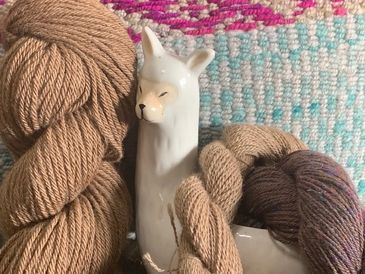Close up image of an idol of an animal with some wool