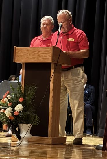 Mike Dabbs President of Kars Unlimited and John Bush Kars Unlimited Vice President presenting schola