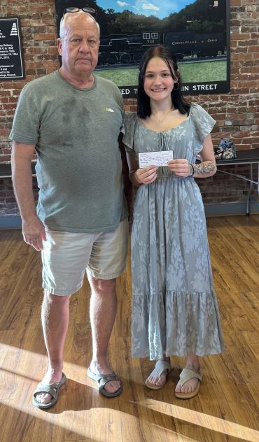 Mackenzie Linkswiler of Alleghany High School receiving the scholarship from Mike Dabbs President of