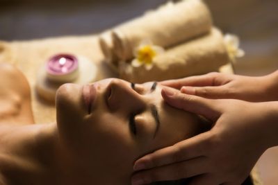 Relaxed woman having facial massage