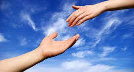 hand reaching for hand