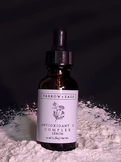Antioxidant C Complex vitamin c serum in an amber bottle on a black background