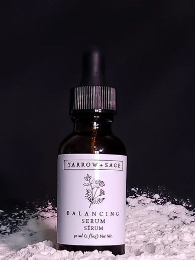 Balancing Serum in an amber bottle on a black background