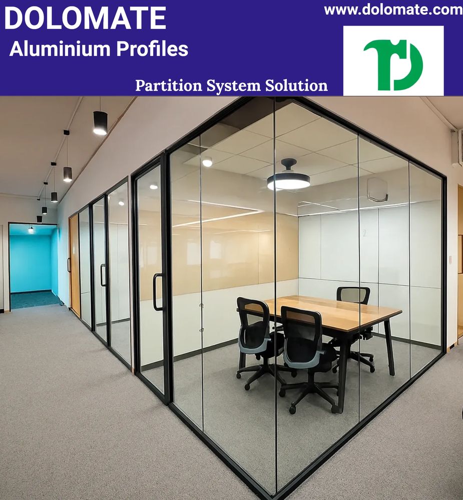 Modern office meeting room with glass partitions and aluminum frames.