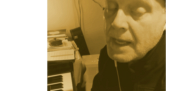 Paul Dobbe playing piano.