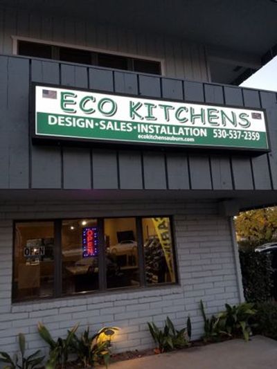 Eco Kitchens sign advertising design, sales, and installation services.