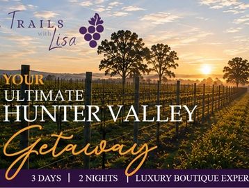 Sunset over Hunter Valley vineyard with getaway advertisement.