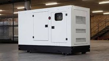A large white industrial generator inside a warehouse.