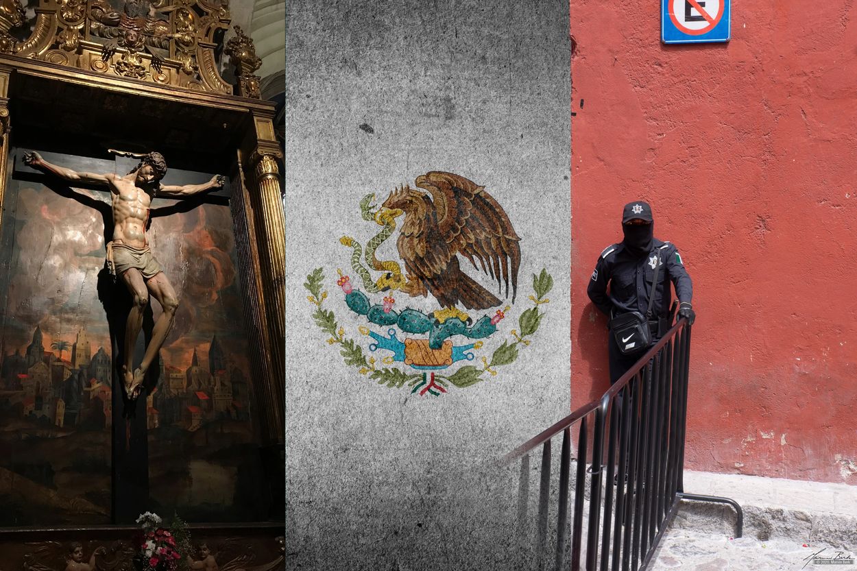 Mexican Flag with Jesus and armed guard