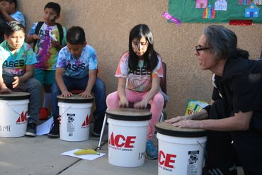 Outdoor bucket drum class.