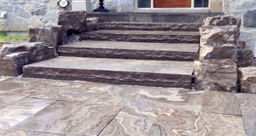 Design and installation of natural rockery, steps and retaining walls.