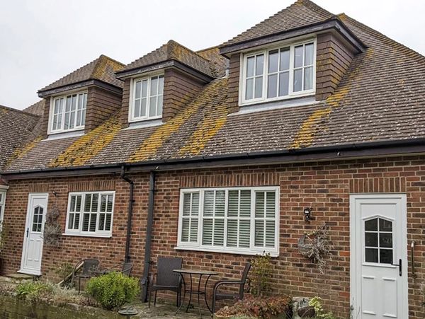 Before image of a roof steam cleaning job in New Romney.