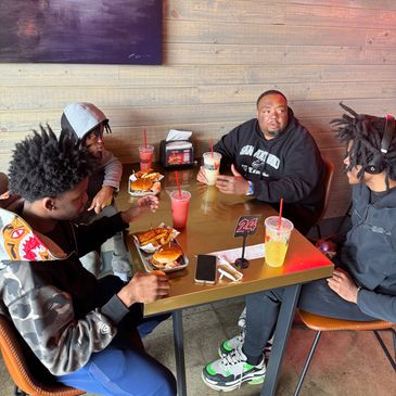 Codi, Curt, and Cortez eating lunch with Dean