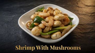 A bowl of shrimp and mushrooms stir-fry with green peppers.