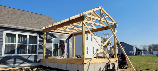 Rough framing of and outdoor living space on a new foundation.