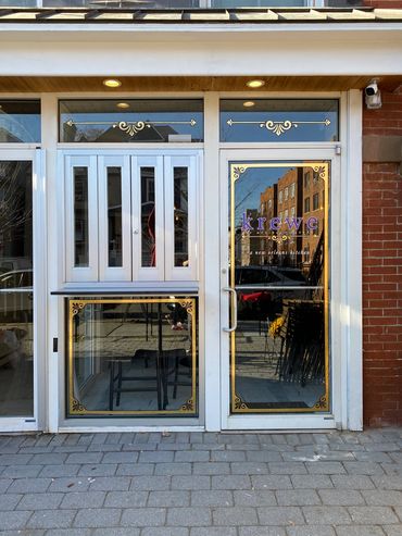 Installing vinyl signs on restaurant window