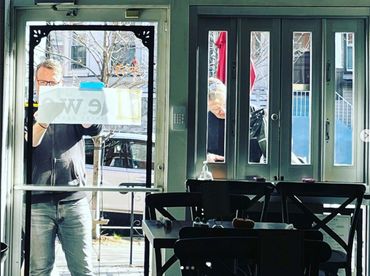 Installing vinyl signs on restaurant window