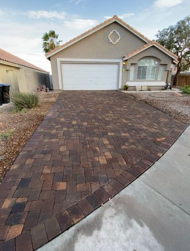 Complete driveway makeover, brought it back to life from a deteriorated concrete to paver.