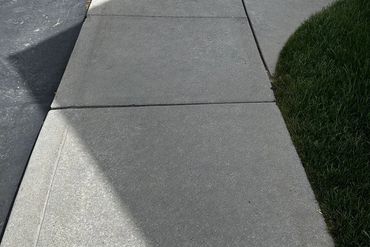 Clean sidewalk after tar removal