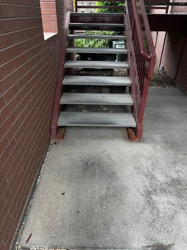 High traffic concrete stairs with oil and grease stains
