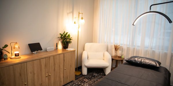 Cozy, softly lit bedroom with modern furniture.