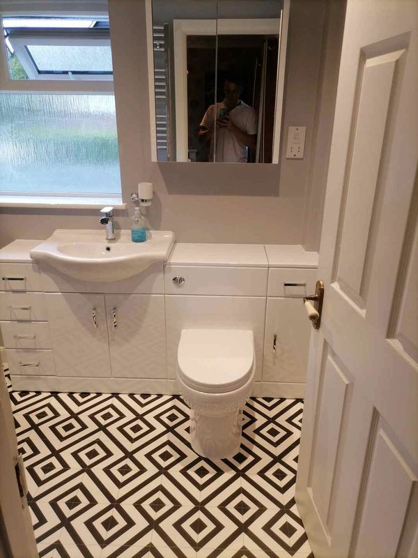 New bathroom installation, white vanity units.