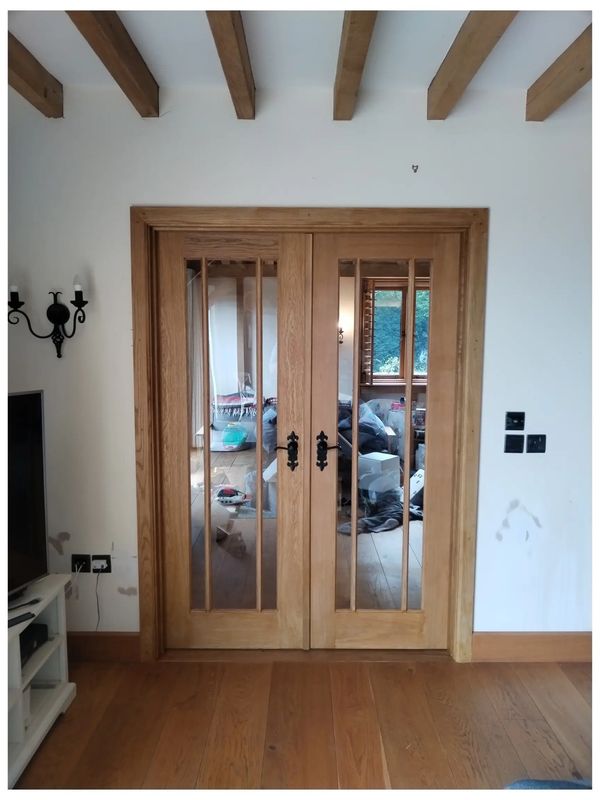 Bespoke carpentry work: installation of oak French doors in to new door opening, in Beare green.