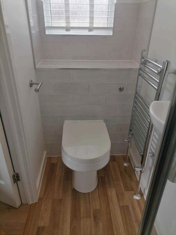 Budget en-Suite toilet. with concealed cistern to achieve a high quality finish on a budget.