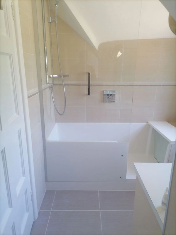 Bathroom installation, new bath, shower, taps, floor & wall tiling.