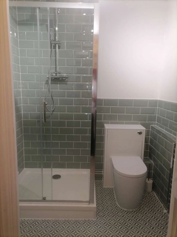 complete budget shower room renovation. Shower, cubicle and vanity toilet installation.