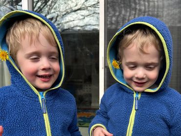 Twin boys with flowers