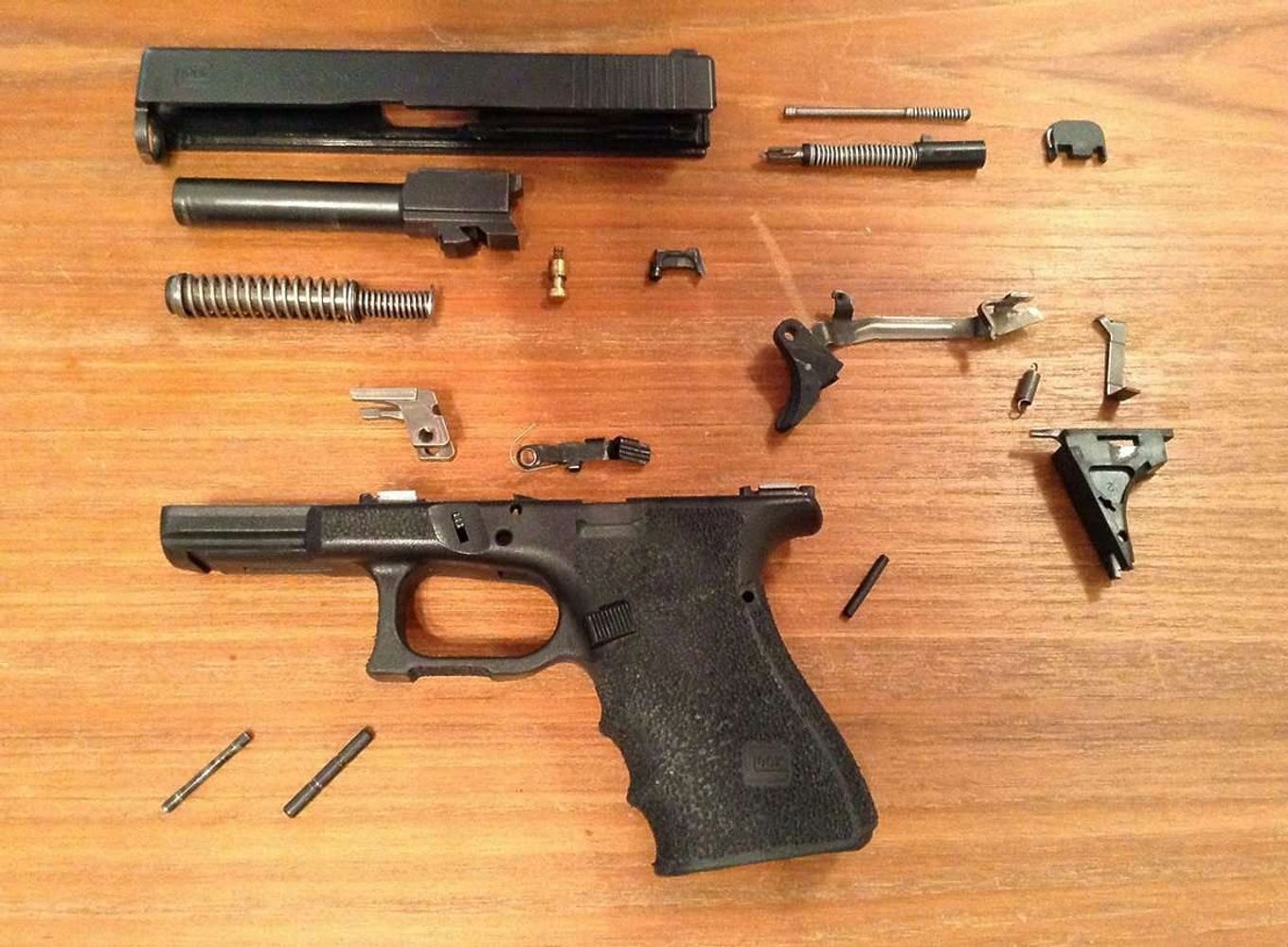Glock Handgun completely disassembled and ready for cleaning and lubrication