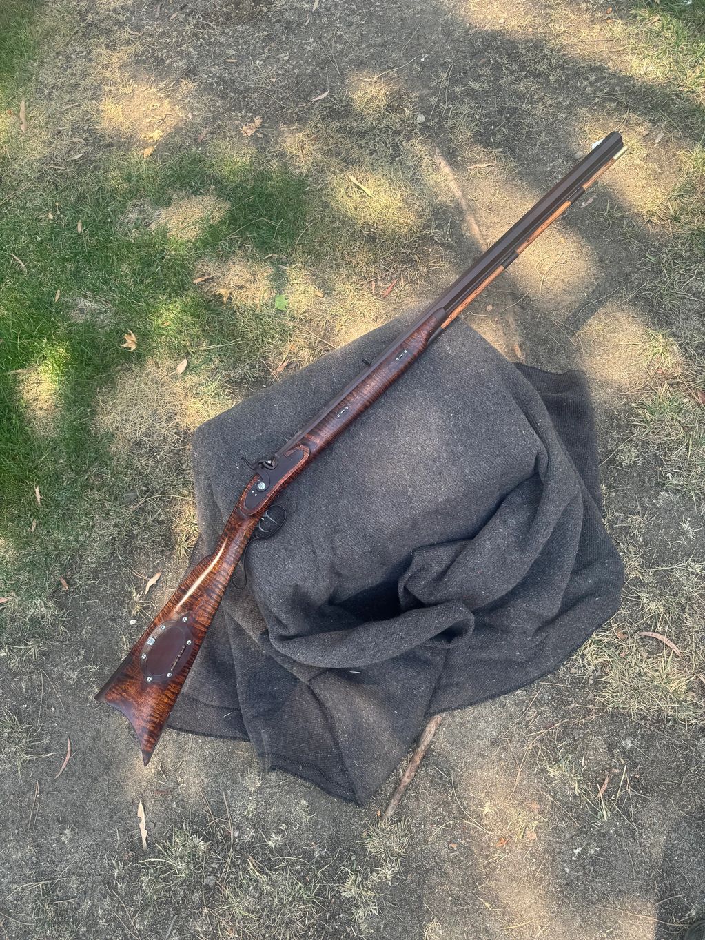 Full view Hawken half stock with patchbox and upgraded curly maple stock