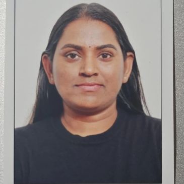 Portrait of a woman with long dark hair wearing a black top.