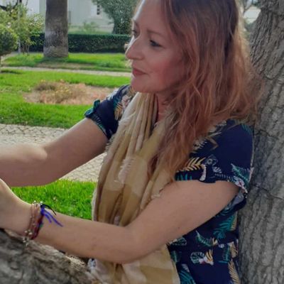 a woman sitting in a tree