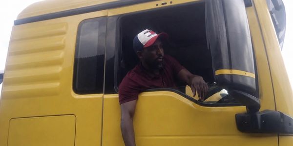 Professional truck driver representing Swisa Global Logistics international recruitment