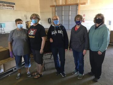 Volunteers wear masks