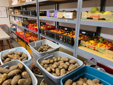 Food pantry shelves filled with fresh produce